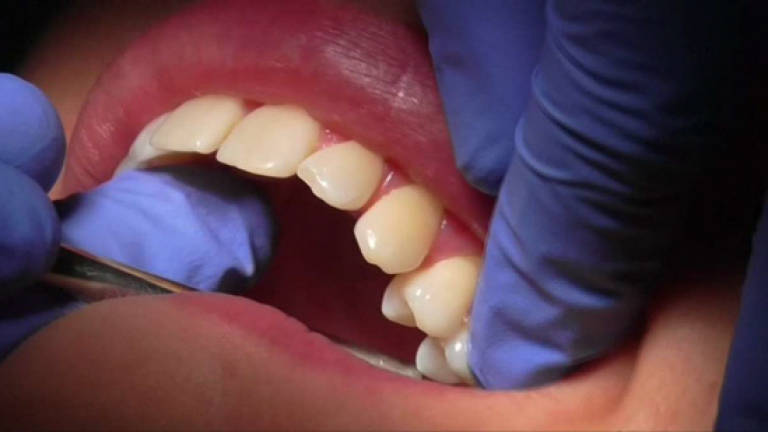 Vocational college graduate fined for operating dental clinic without licence