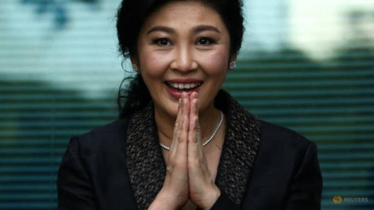 Thailand revokes passports of exiled former PM Yingluck