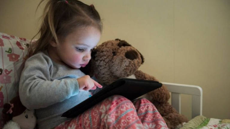Toddlers playing with touchscreens sleep less