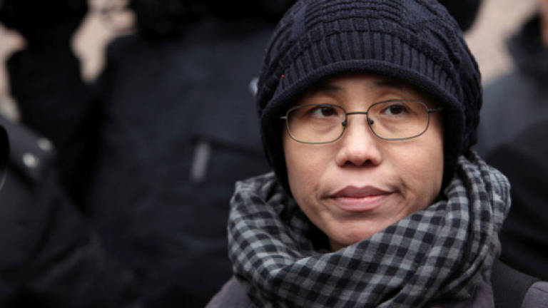Widow of Chinese dissident Liu back in Beijing