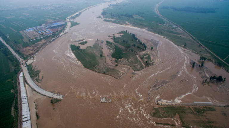 Four officials suspended over deadly China flooding