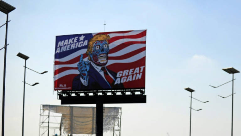Alien Trump descends on Mexico in artist's billboard