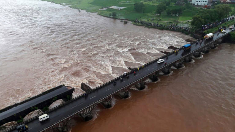 22 missing after India bridge collapse
