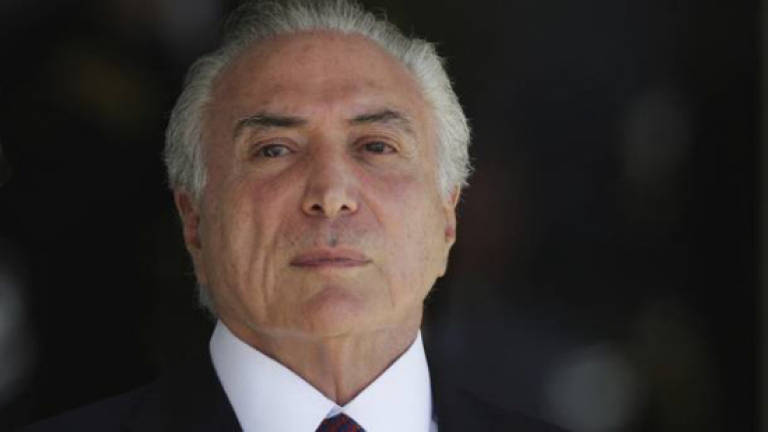Brazilian police accuse Temer of receiving bribes