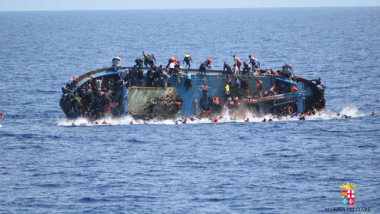 More than 100 migrants missing after shipwreck off Libya: Navy