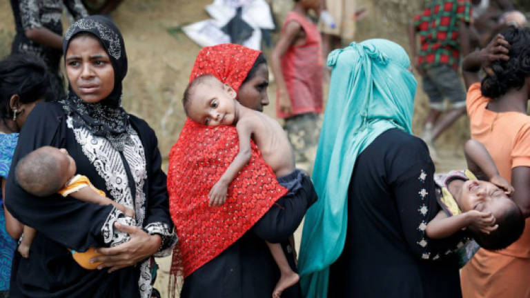 Bangladesh rescues 20 Rohingya held by refugee racket gang