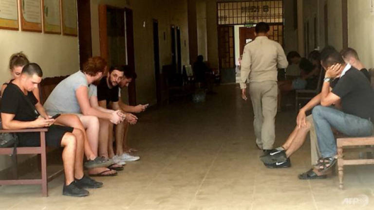 Cambodia expels foreigners jailed for 'pornographic' party