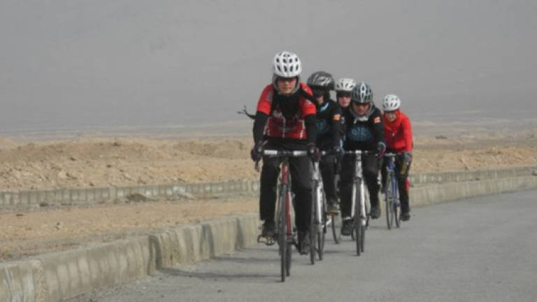 Afghan cycling sisters take refuge in home of 'Grand Boucle'