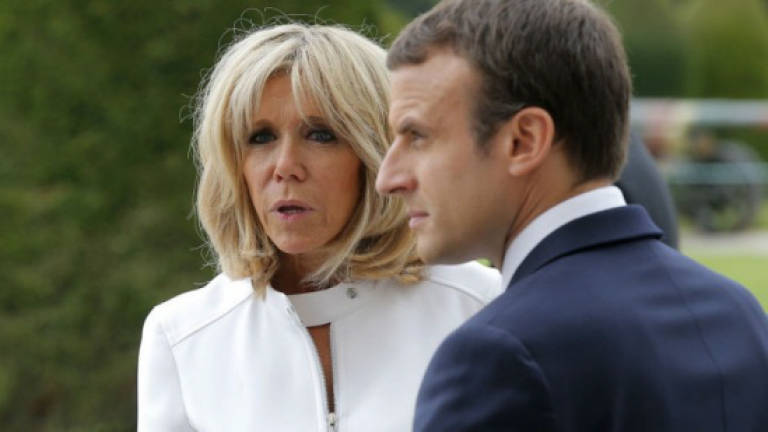 Macron files police complaint against photographer