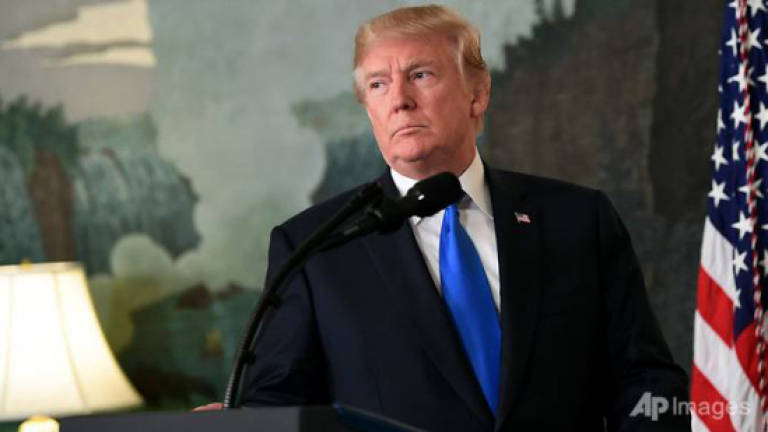 Trump tears into Iran, leaves nuclear deal hanging
