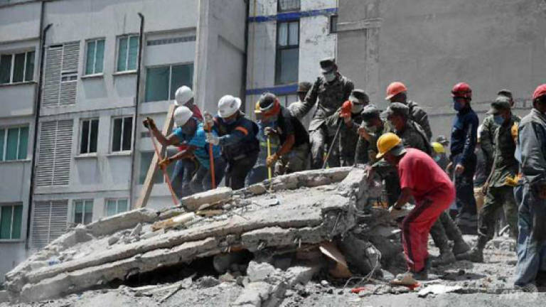 Rescuers in grim search for survivors of Mexico quake