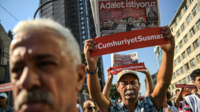 Turkey orders releases in newspaper trial, keeps top journalists in jail