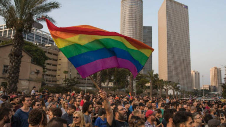 Israel pledges law giving gays equal adoption rights
