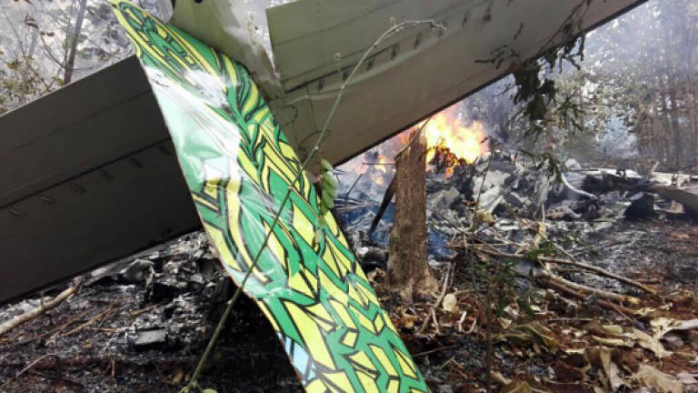 Winds seen as factor in Costa Rica plane crash that killed 12