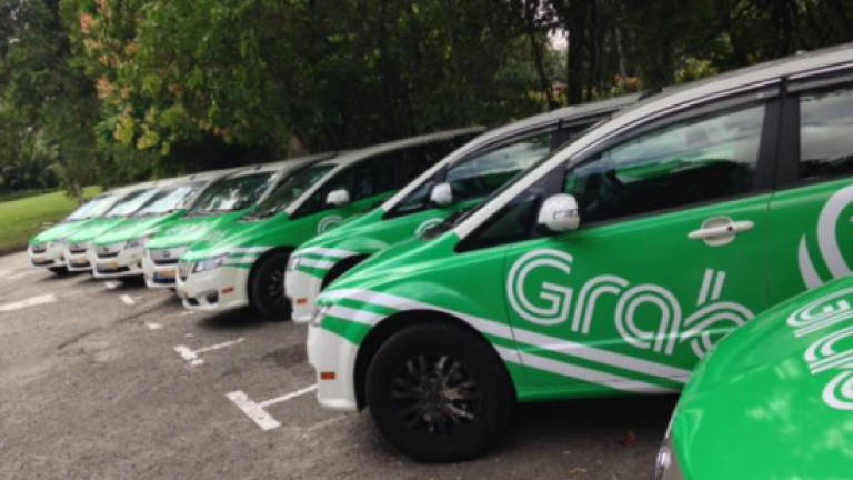Thumbs up from Grab and Uber
