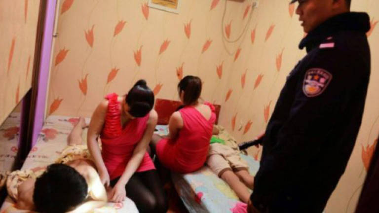 Massage parlour managers detained for suspected human trafficking