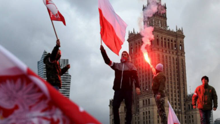 Tens of thousands join Polish nationalists' march on independence day