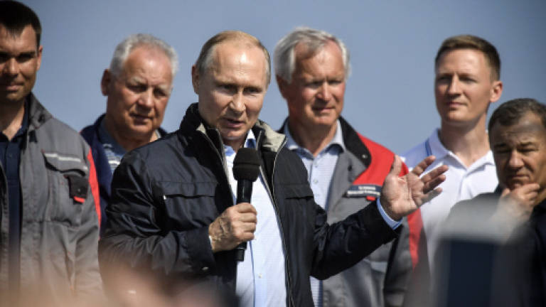 Putin opens new bridge to Crimea, provoking Ukraine, Western ire