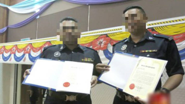 Two cops may have integrity awards revoked for soliciting
