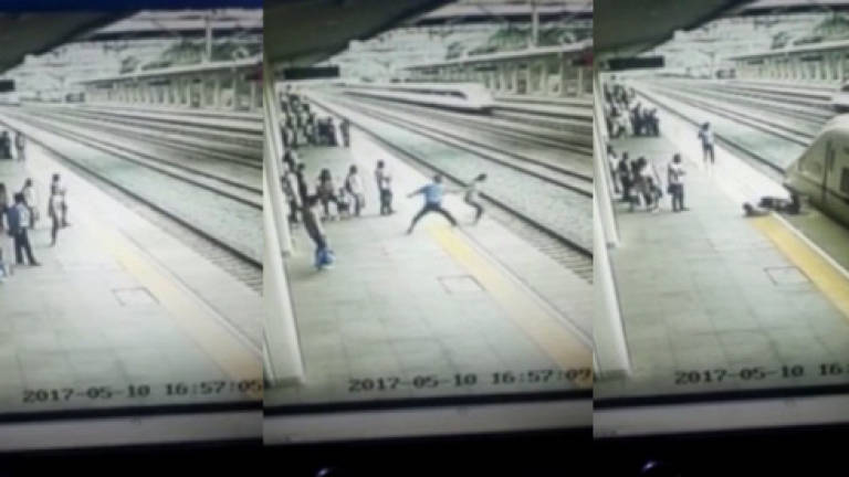 (Video) Railway worker stops student from throwing herself in front of train