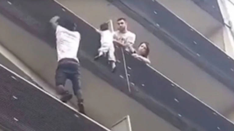 (Video) 'Hero' who saved dangling child to get French citizenship: Macron