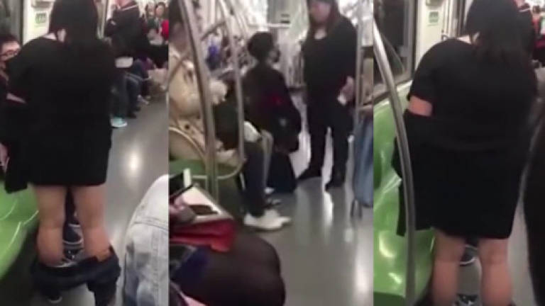Woman pulls her pants down in crowded train demanding lover to apologise