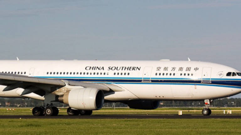 Chinese passenger chucks coins into plane's engine for luck