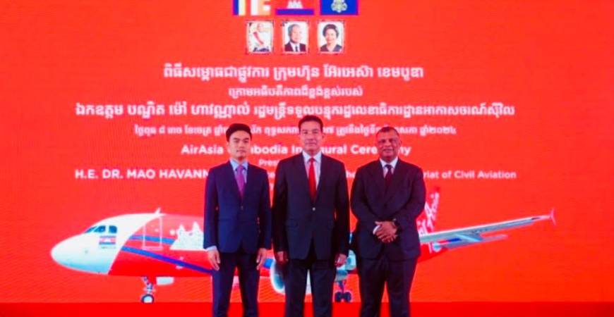 From left: Vissoth, Minister in Charge of State Secretariat of Civil Aviation Dr Mao Havannall and Fernandes at the commemoration ceremony of AirAsia Cambodia in Phnom Penh today. – AirAsia pic