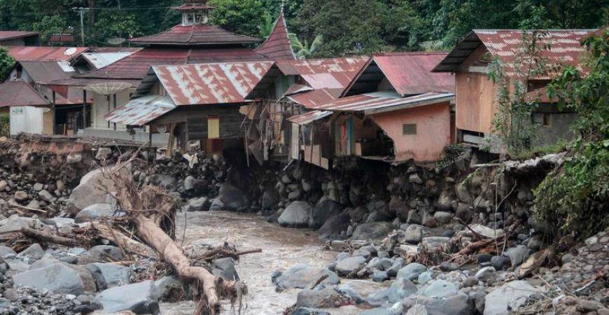 Damaged houses are seen after flash floods and cold lava flow from a volcano in Tanah Datar, West Sumatra, on May 12, 2024. - AFPPIX