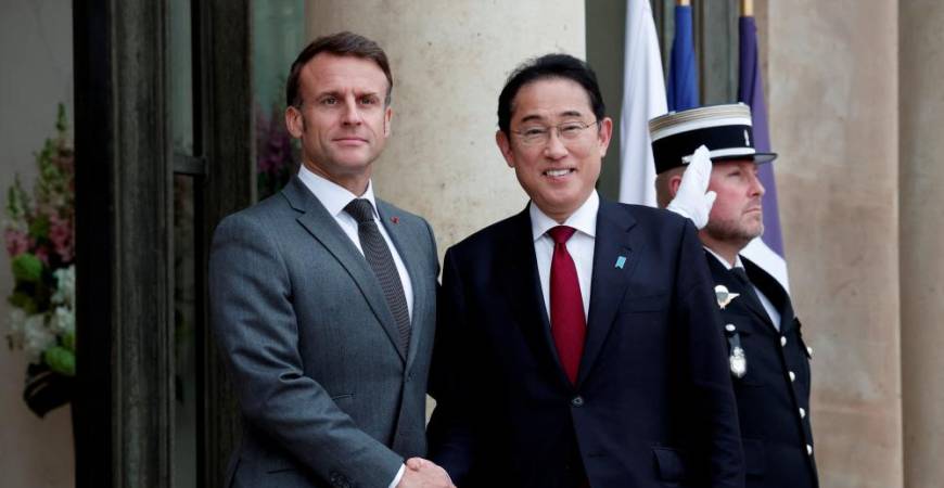 French President Emmanuel Macron welcomes Japan's Prime Minister Fumio Kishida as he arrives for a meeting at the Elysee Palace in Paris, France, May 2, 2024. - REUTERSPIX