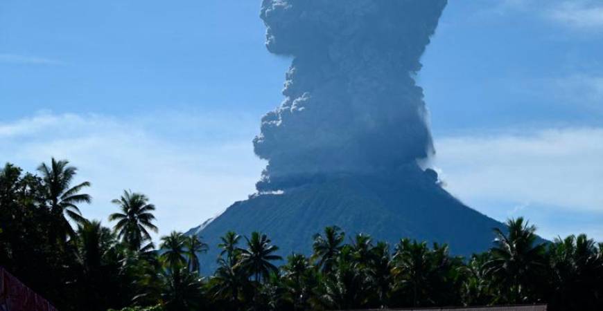 This handout photo taken and released by the Center for Volcanology and Geological Hazard Mitigation (PVMBG) on May 13, 2024 shows Mount Ibu spewing thick smoke in Indonesia's North Maluku Province. - AFPPIX