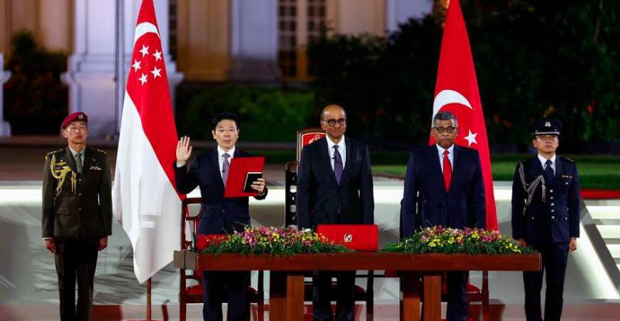 Singapore's Deputy Prime Minister and Minister of Finance Lawrence Wong is sworn in as Singapore's fourth Prime Minister next to Singapore's President Tharman Shanmugaratnam and Chief Justice Sundaresh Menon at the Istana, in Singapore, May 15, 2024. - REUTERSPIX