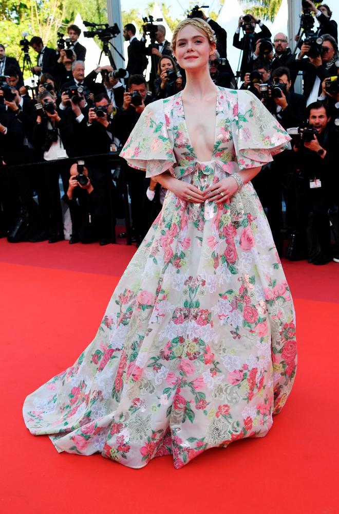Elle Fanning arrives for the screening of the film Les Miserables at the 72nd edition of the Cannes Film Festival in Cannes, southern France, on May 15, 2019. © Alberto PIZZOLI / AFP