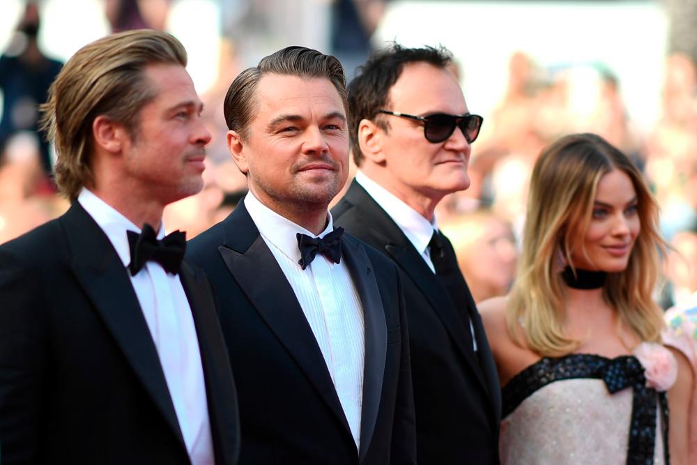 US actor Brad Pitt, US actor Leonardo DiCaprio, US film director, screenwriter, producer, and actor Quentin Tarantino and Australian actress Margot Robbie at the Cannes film festival. -AFP
