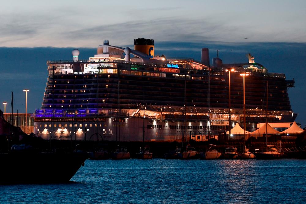 The Costa Smeralda cruise ship is seen docked in the Civitavecchia port 70km north of Rome on the evening of January 30, 2020. © Filippo MONTEFORTE / AFP