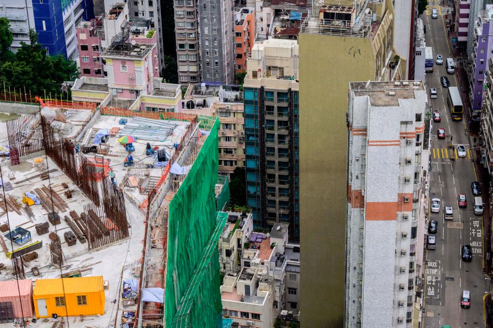 While Hong Kong's wealthy think nothing of dropping millions of dollars for their homes, millions of the city's residents struggle to afford the rent on shoe-box apartments – many smaller than the parking space.
