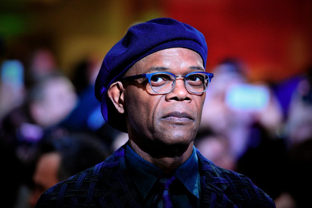 The Banker, starring Samuel L Jackson, is based on the true story of two black businessmen who hired a working-class white man to front their empire and combat racism in 1960s America. © AFP PHOTO / CARL COURT