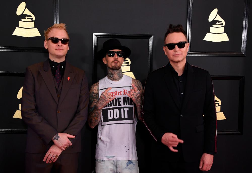 Blink-182 arrives for the 59th Grammy Awards pre-telecast in 2017 - MARK RALSTON/AFP