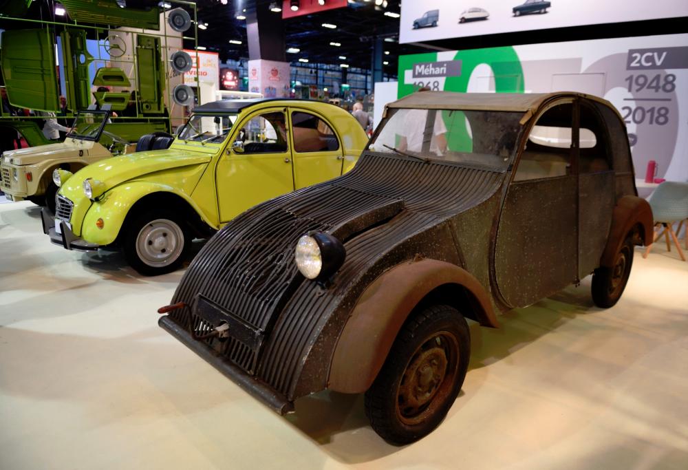 The Citroën 2 CV and its ancestor, the TPV, seen at Rétromobile 2018, an exhibition of vintage motor vehicles at the Paris Expo in Porte de Versailles in Paris on Feb 6, 2018.