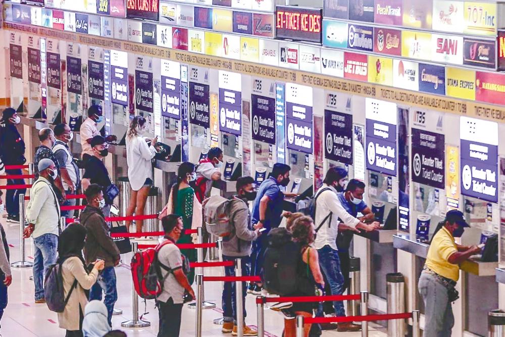 Longer-than-usual queues were seen at the ticketing counters at Terminal Bersepadu Selatan in Bandar Tasik Selatan, Kuala Lumpur yesterday. Many in the queues were buying balik kampung tickets ahead of the festive season. – MOHD AMIRUL SYAFIQ/THESUN