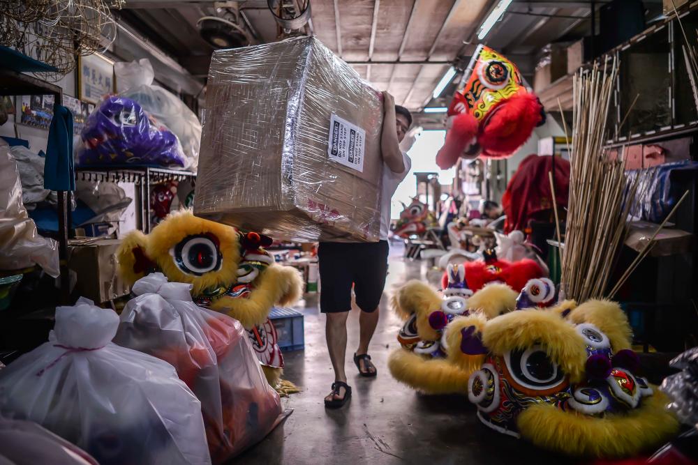 $!For the overseas customers, Wong will put the lion head into a sturdy box with extra protective layers so that customers will get the lion head in pristine condition. ADIB RAWI YAHYA/THESUN