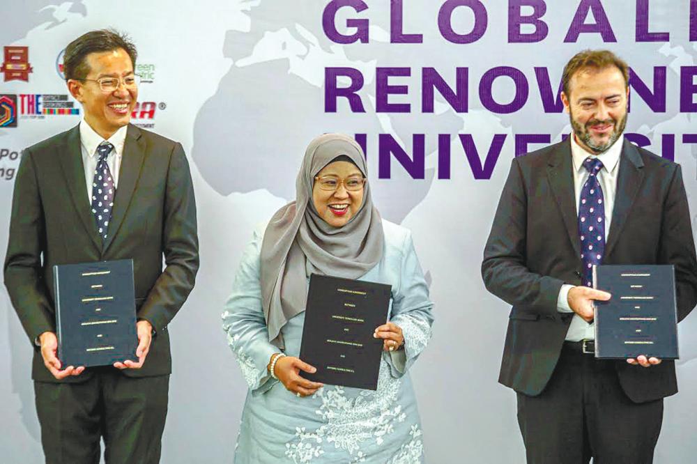 From left: Wong, Roziah and Entomo Agroindustrial chief science officer Juan Cortes at the ceremony in UiTM yesterday. – AMIRUL SYAFIQ/THESUN