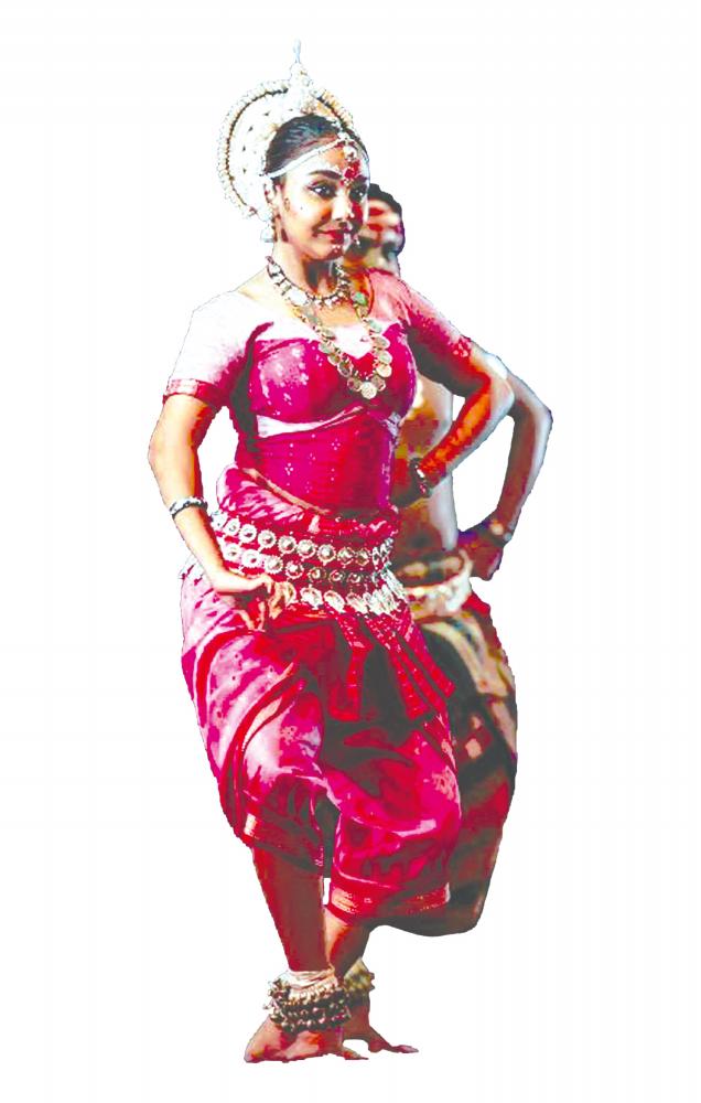 Kirthana performing a classical dance move.