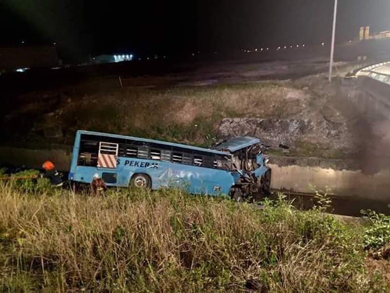 The bus that plunged into a drain near the MASKargo area in Sepang. — Facebook photo