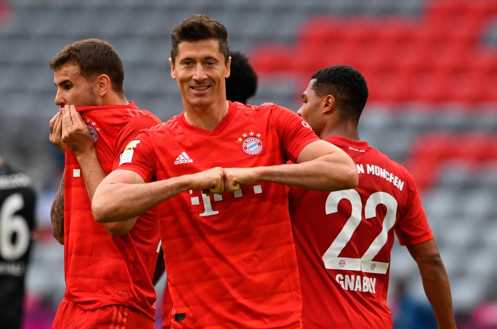 Bayern Munich’s forward Robert Lewandowski celebrates after scoring a goal during the German Bundesliga match against Fortuna Duesseldorf at the Allianz Arena stadium in Munich on 30 May 2020. – EPAPIX