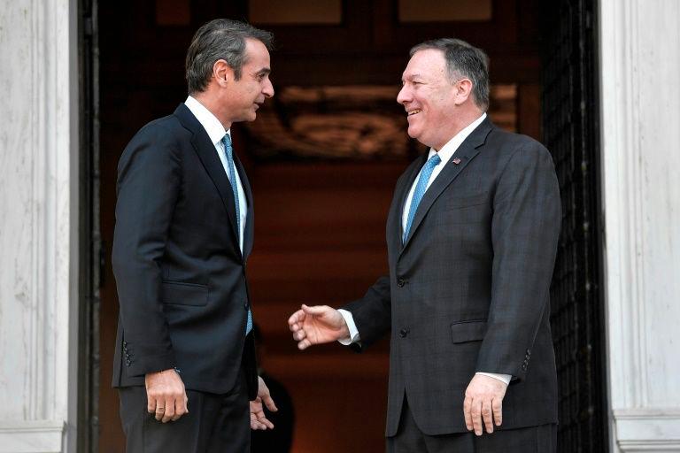 Greek Prime Minister Kyriakos Mitsotakis (Left) welcomes US Secretary of State Mike Pompeo during his visit to Athens in Oct 2019. — AFP