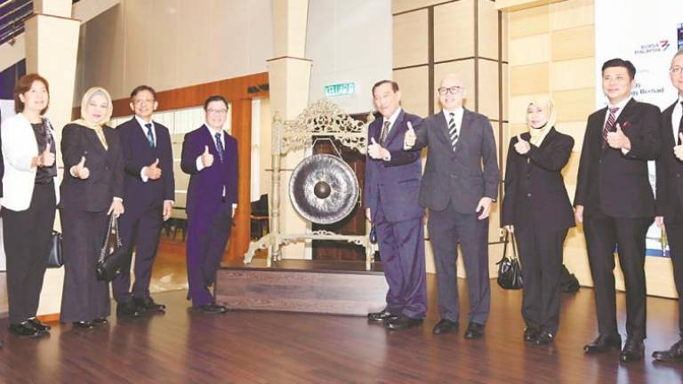 From left: M&amp;A Securities deputy head of corporate finance Danny Wong, Swift Energy Technology independent non-executive directors Yee Kim Mei and Zurul Ain Zulkarnain, executive director and COO Chin Saw Yong, Tan, Mohammad Nazir, independent non-executive director Leong Choong Wah, corporate affairs director Suzana Abu Bakar, and M&amp;A Securities managing director Datuk Bill Tan and head of corporate finance Gary Ting at the listing ceremony.