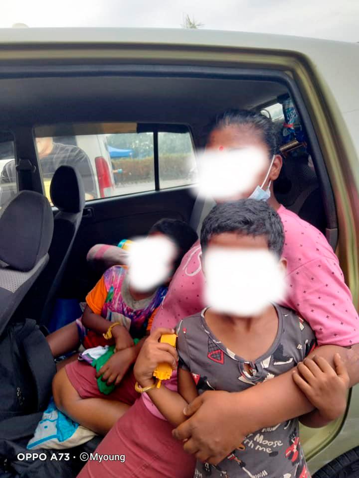 The mother and two of the children along with the car that they have been calling home (image edited to protect their identities). – Facebook