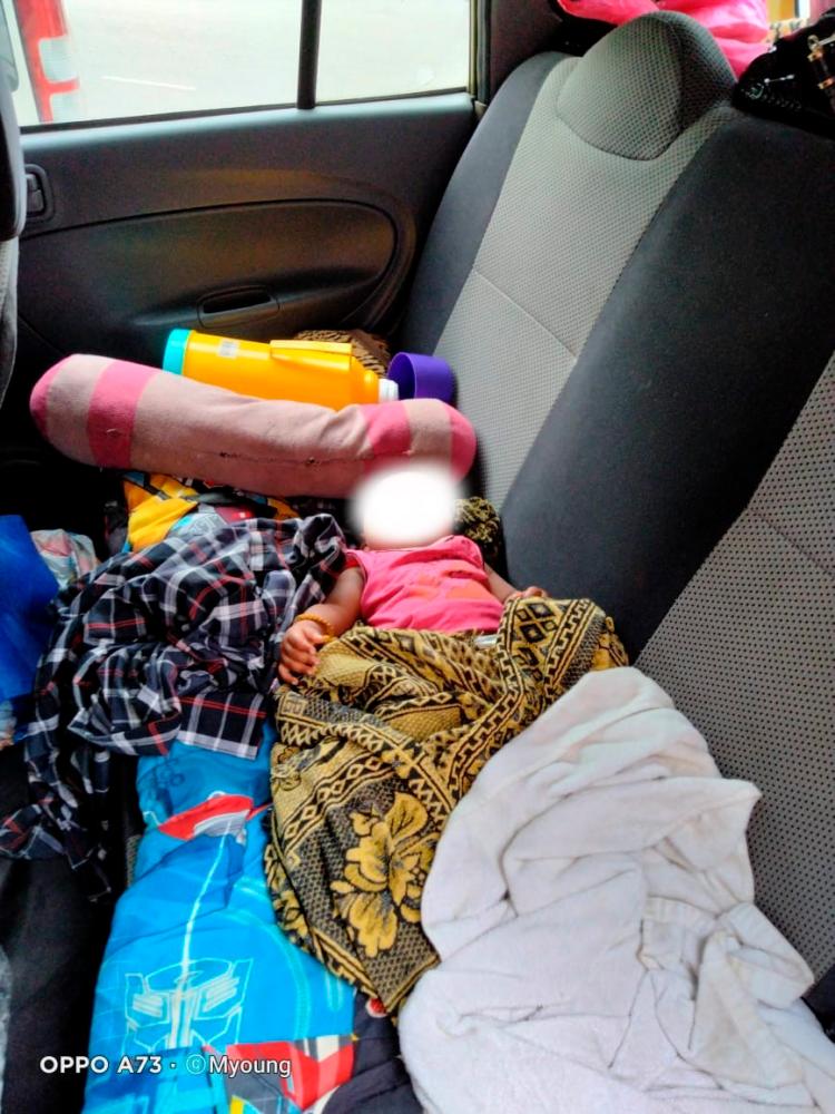 $!The family’s littlest member sleeping in the car. – Facebook