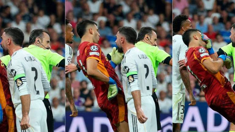 This combination of pictures created on September 16, 2025 shows Real Madrid’s Spanish defender #02 Dani Carvajal who received a red card for head butting Marseille’s Argentine goalkeeper #01 Geronimo Rulli (L) during the UEFA Champions League first round day 1 football match between Real Madrid CF and Olympique de Marseille at the Santiago Bernabeu stadium in Madrid. AFPpix
